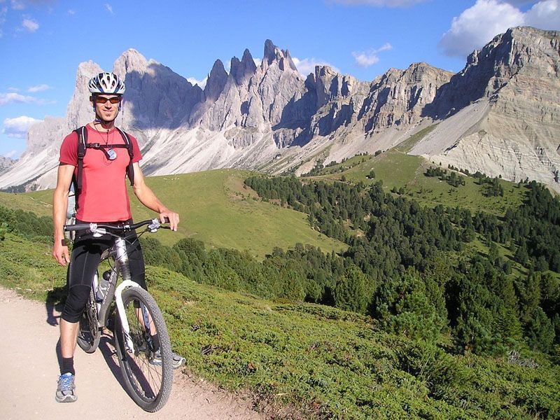 Man cycling in the mountains of Alleghe