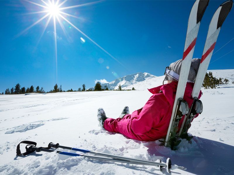 Woman relaxing on the ski slopes of Alleghe